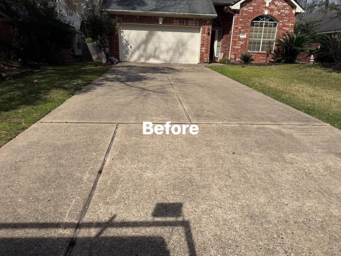 Driveway before pressure washing